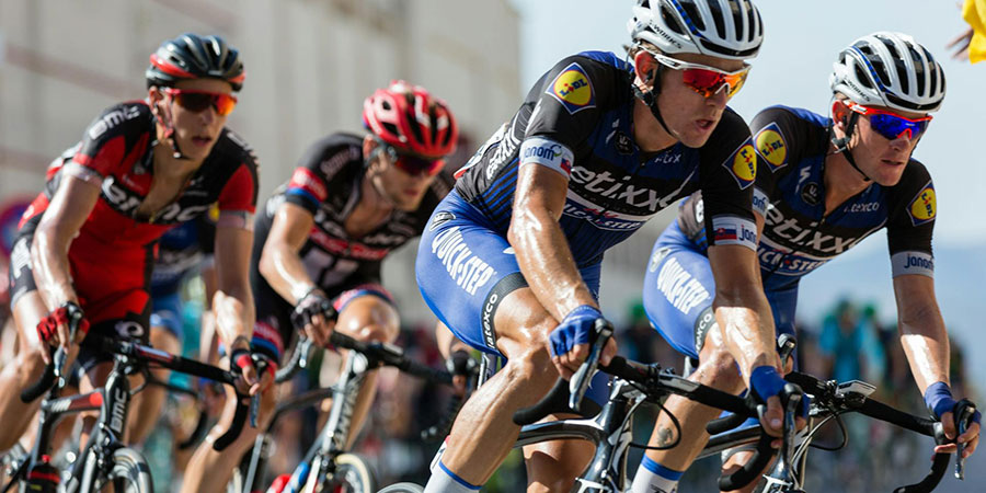 several cyclist riding their bicycle competing in a race